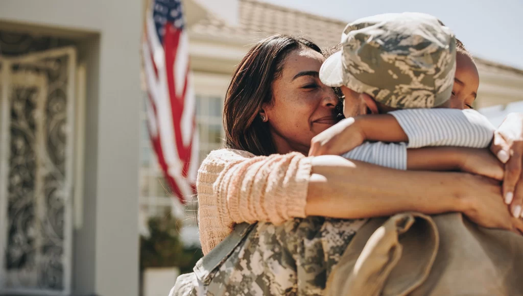 Soldier hugging his wife